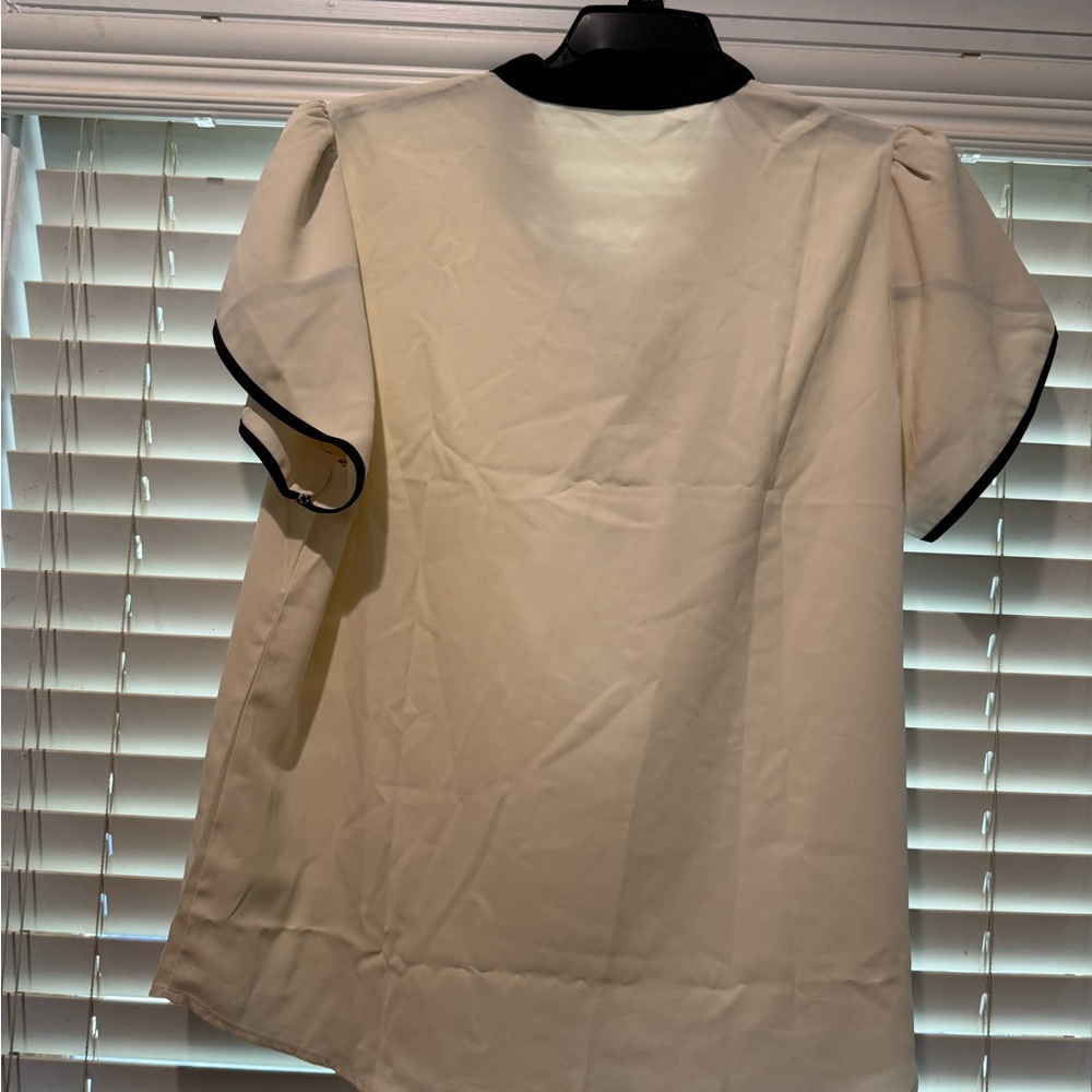 Elegant Cream Blouse with Black Trim